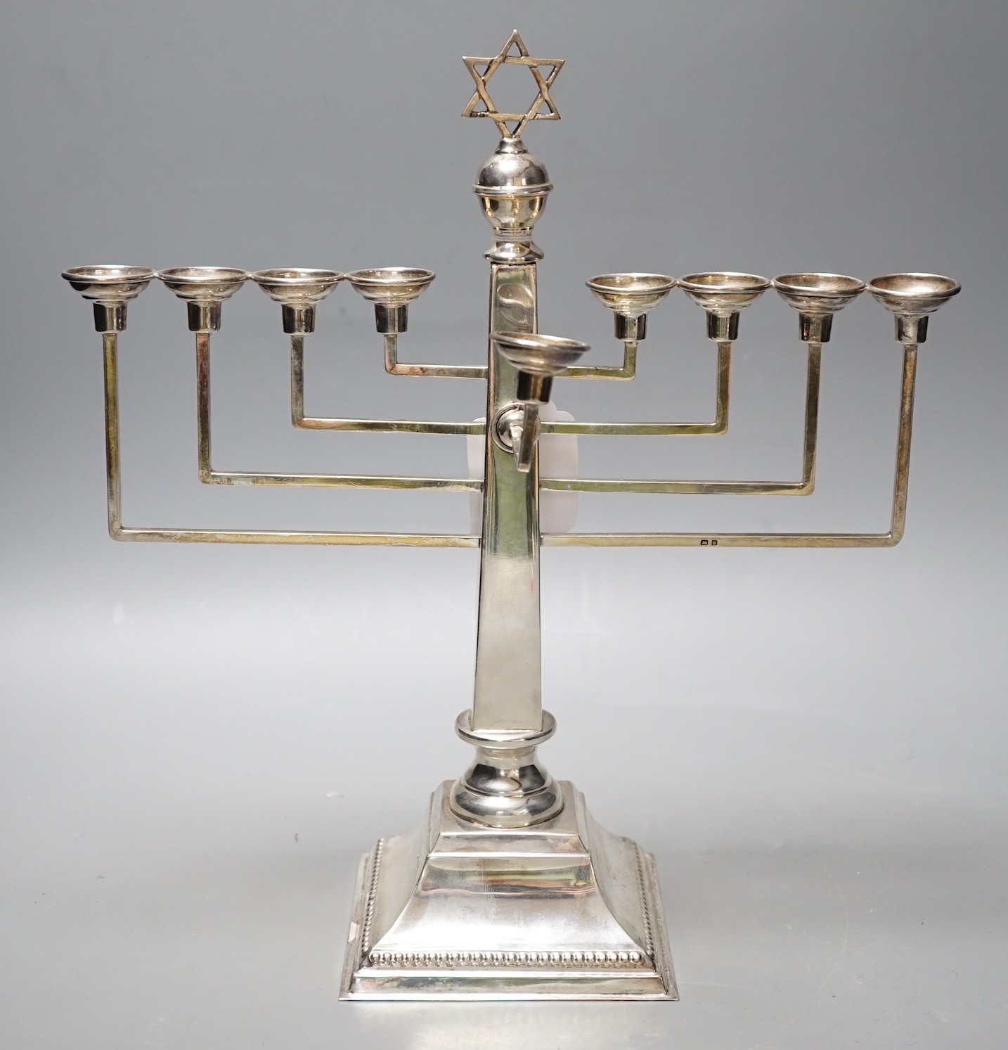 A George VI silver Hanukkah menorah, by A. Taite & Sons Ltd, London, 1948, height 30.5cm, 16.8oz.